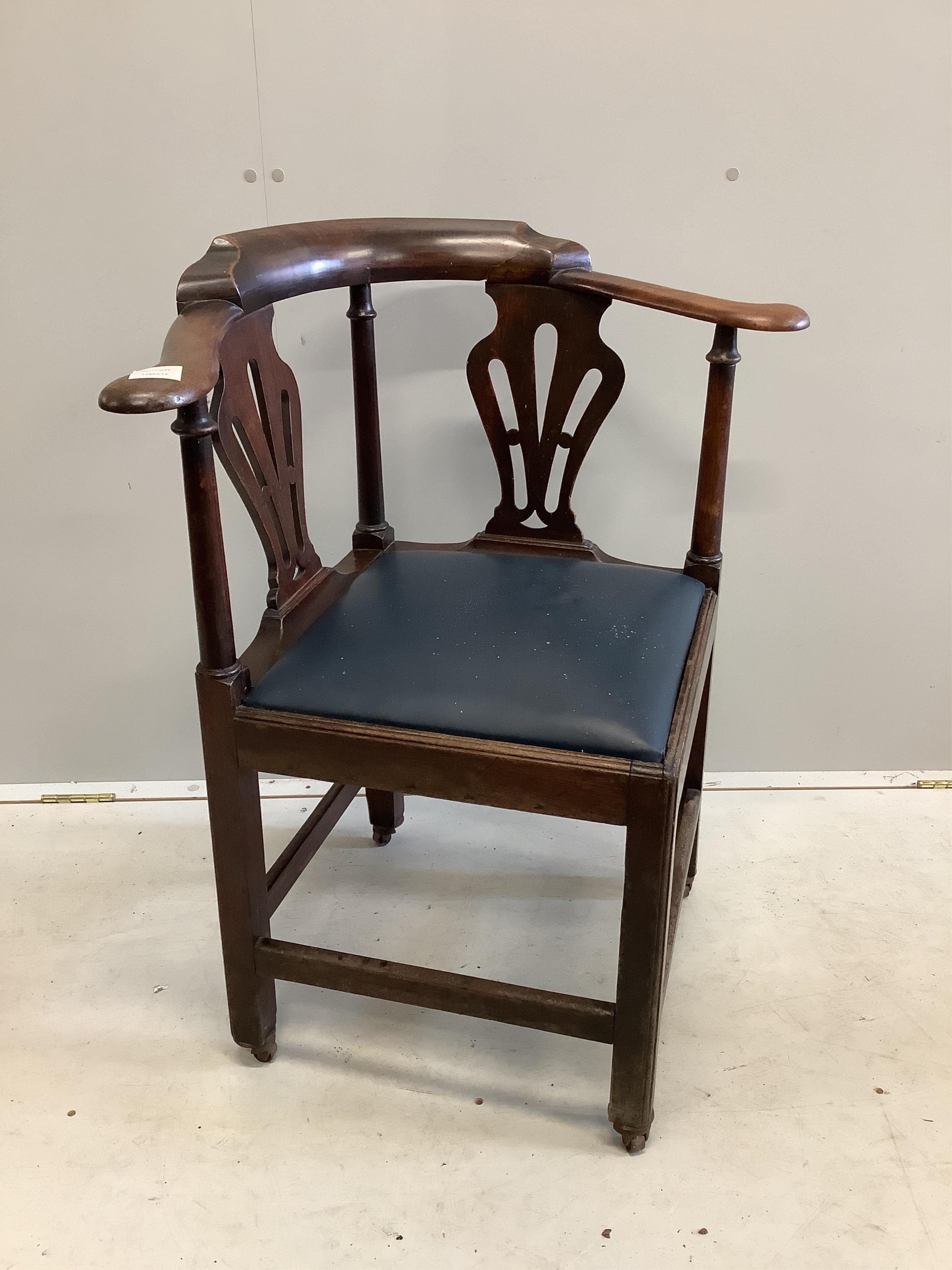 A George III mahogany corner elbow chair. Condition - fair to good